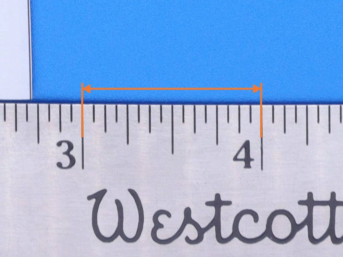 The same ruler up close, with an orange bracket between the 3 and 4 inch marks.